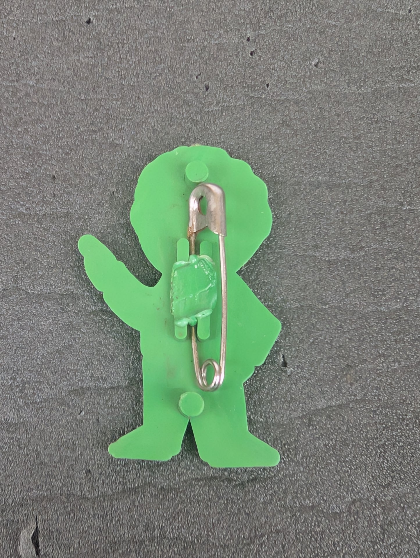 PG Plastic Golly Silver on Green 1970s