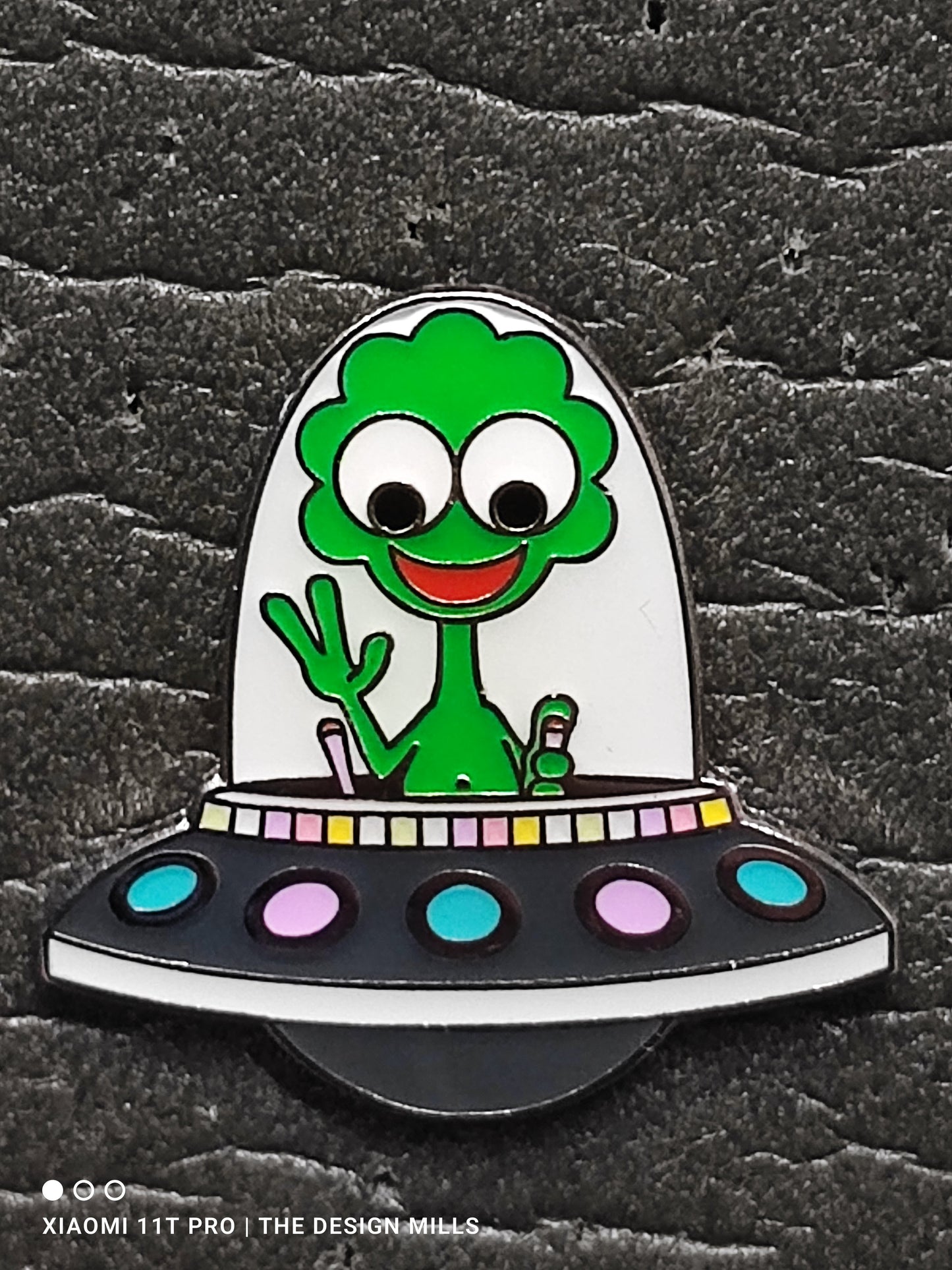 Green Alien in Grey Spaceship