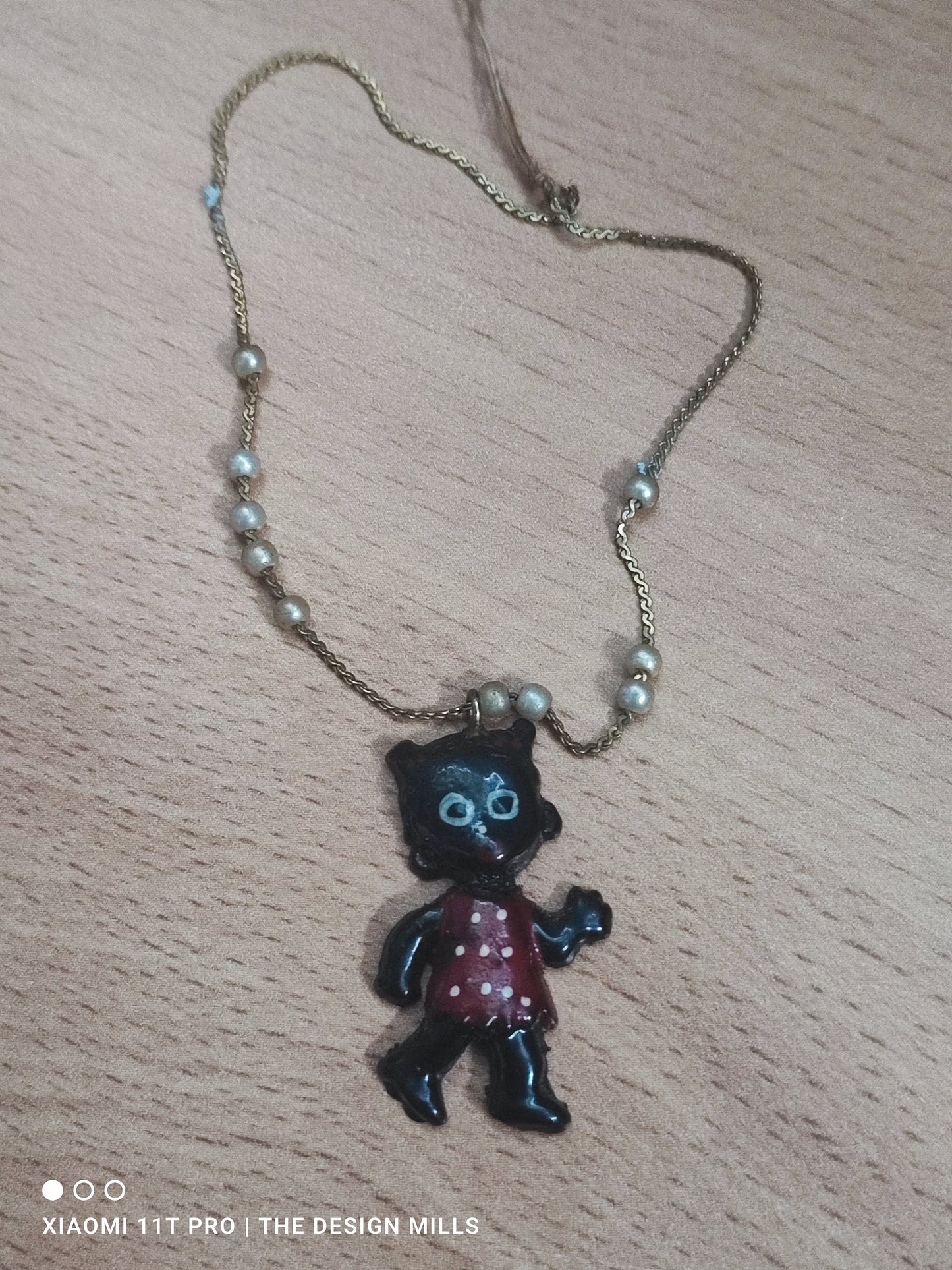 Small Plastic Golly Pendant on Bracelet