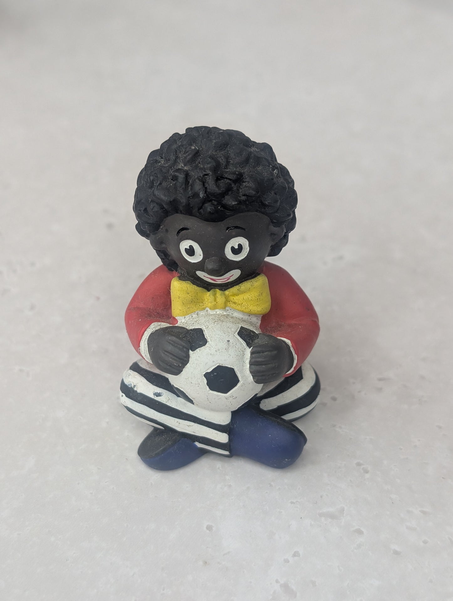 Golly Holding Football Figure