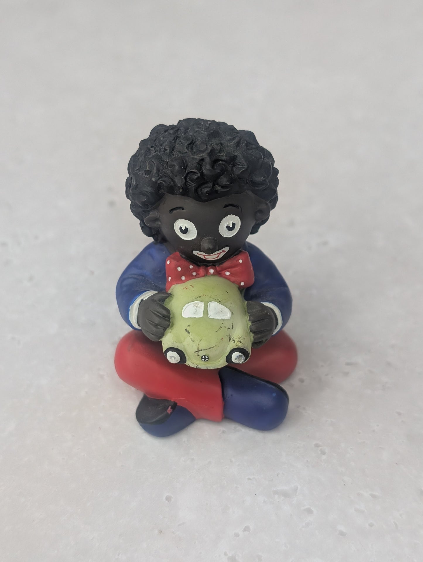 Golly Holding Green Car Figure