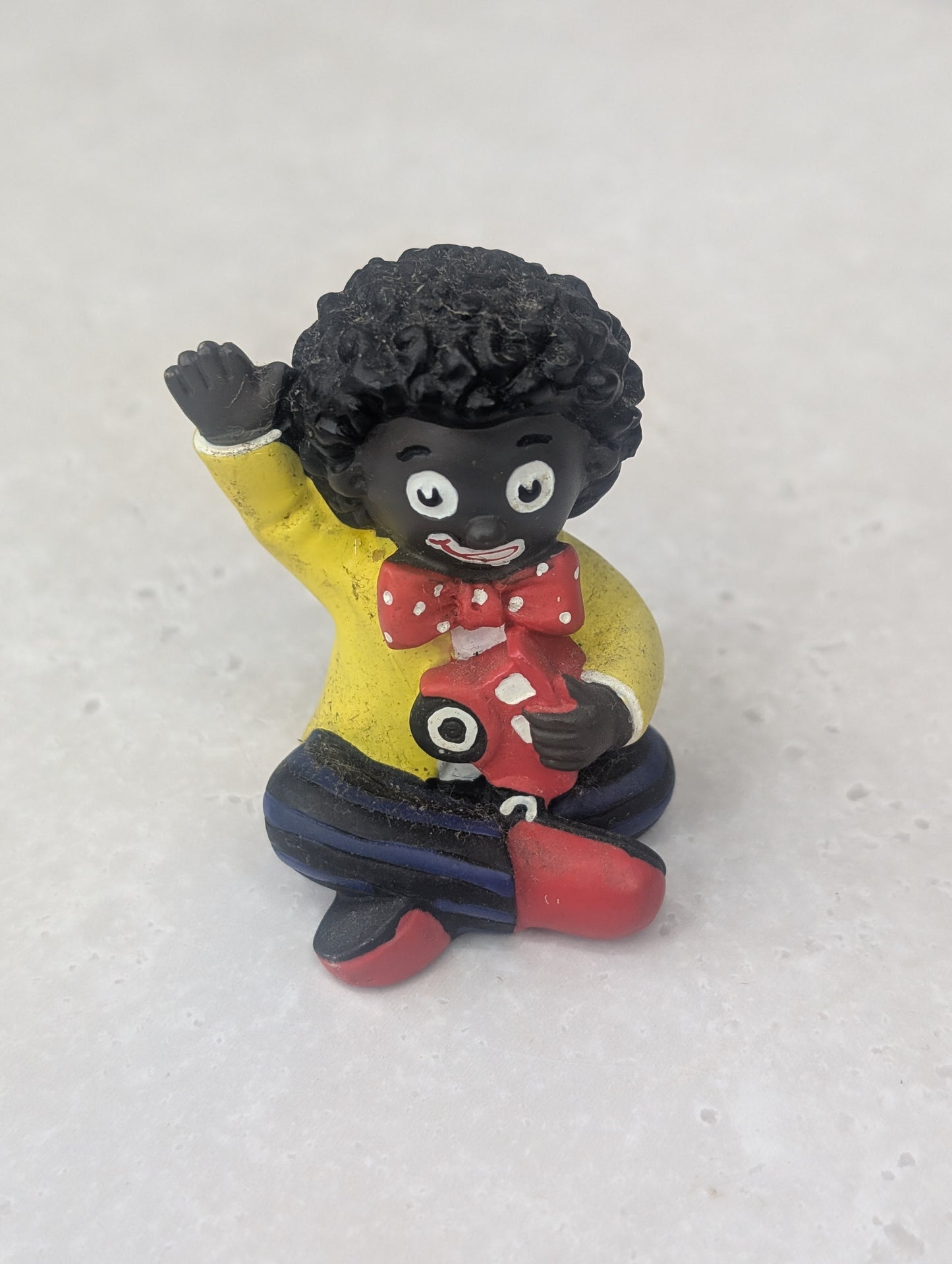 Golly Holding Red Car Figure