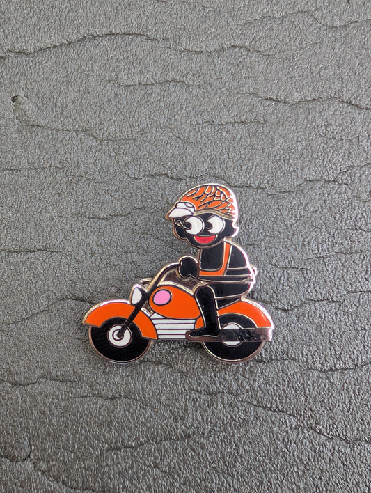 Golly on Orange Motorbike
