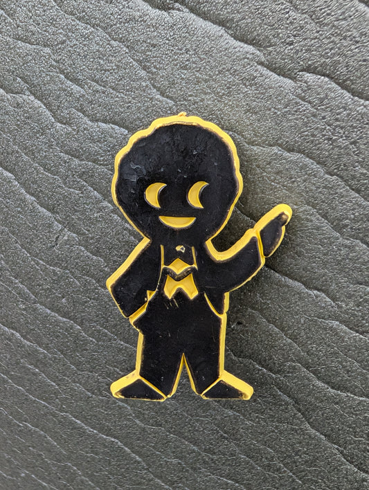 PG Plastic Golly Black on Yellow 1970s