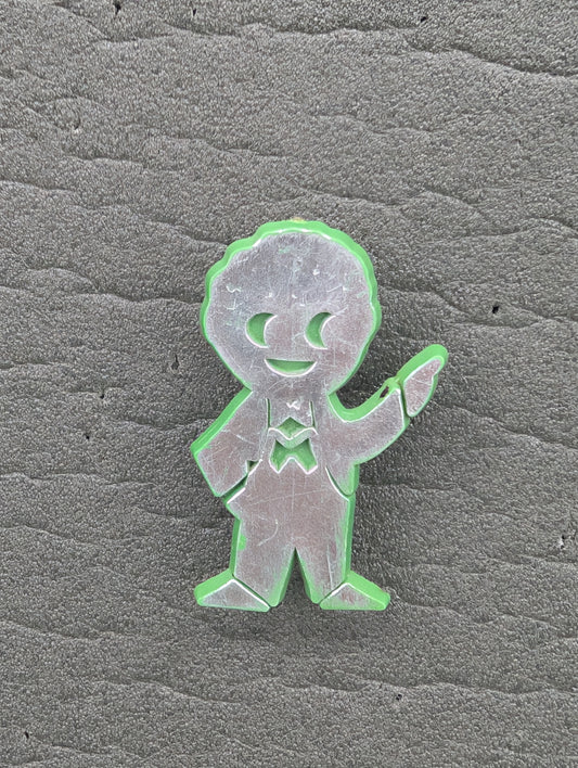 PG Plastic Golly Silver on Green 1970s