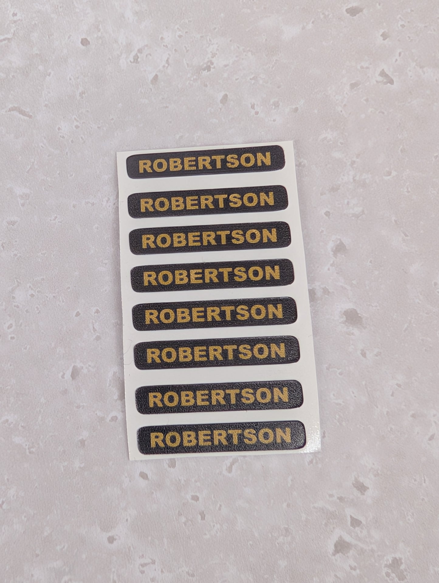 Set of 8 Replacement Robertson Stickers for Plaster Figures.