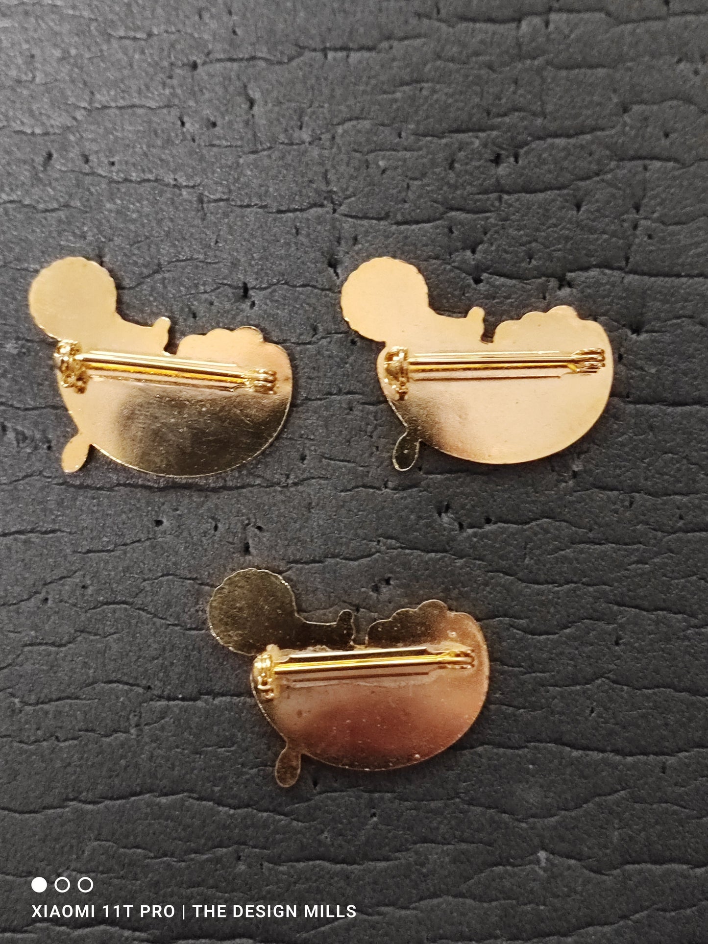 Golden Cargo Trio of Badges